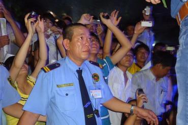 Protecting famous singer Dam Vinh Hung during Scholarship Award Event